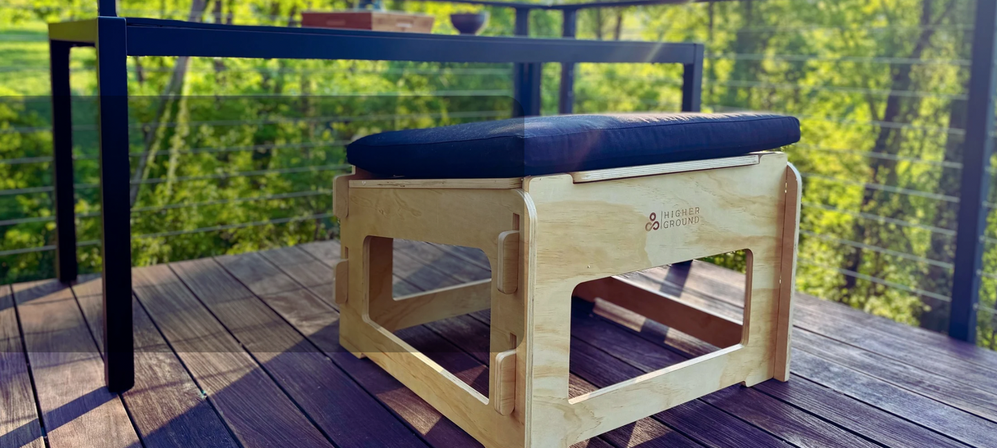 A Higher Ground Chair on a deck in front of a tea table