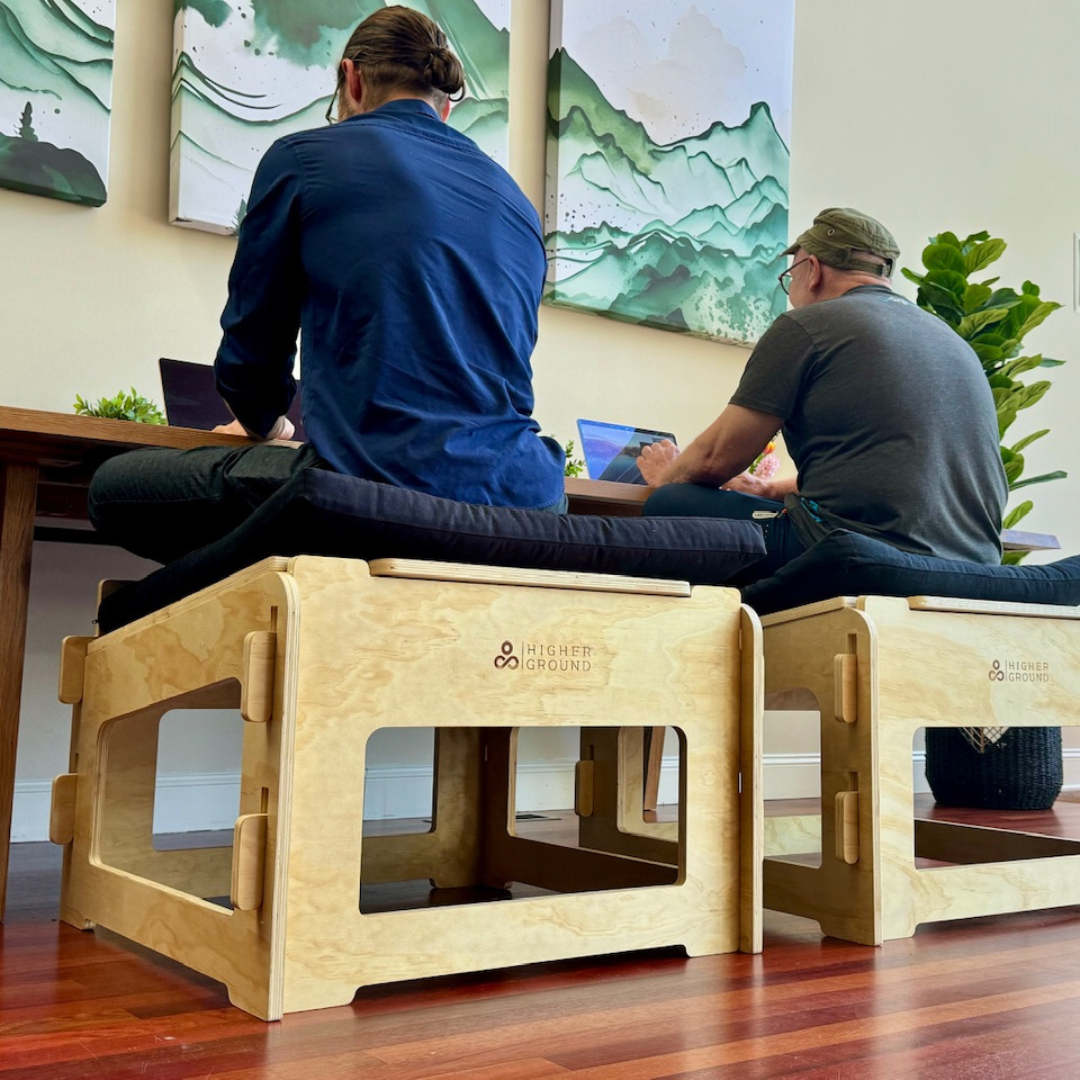 Two men seen from above sitting actively seen from ground level perspective