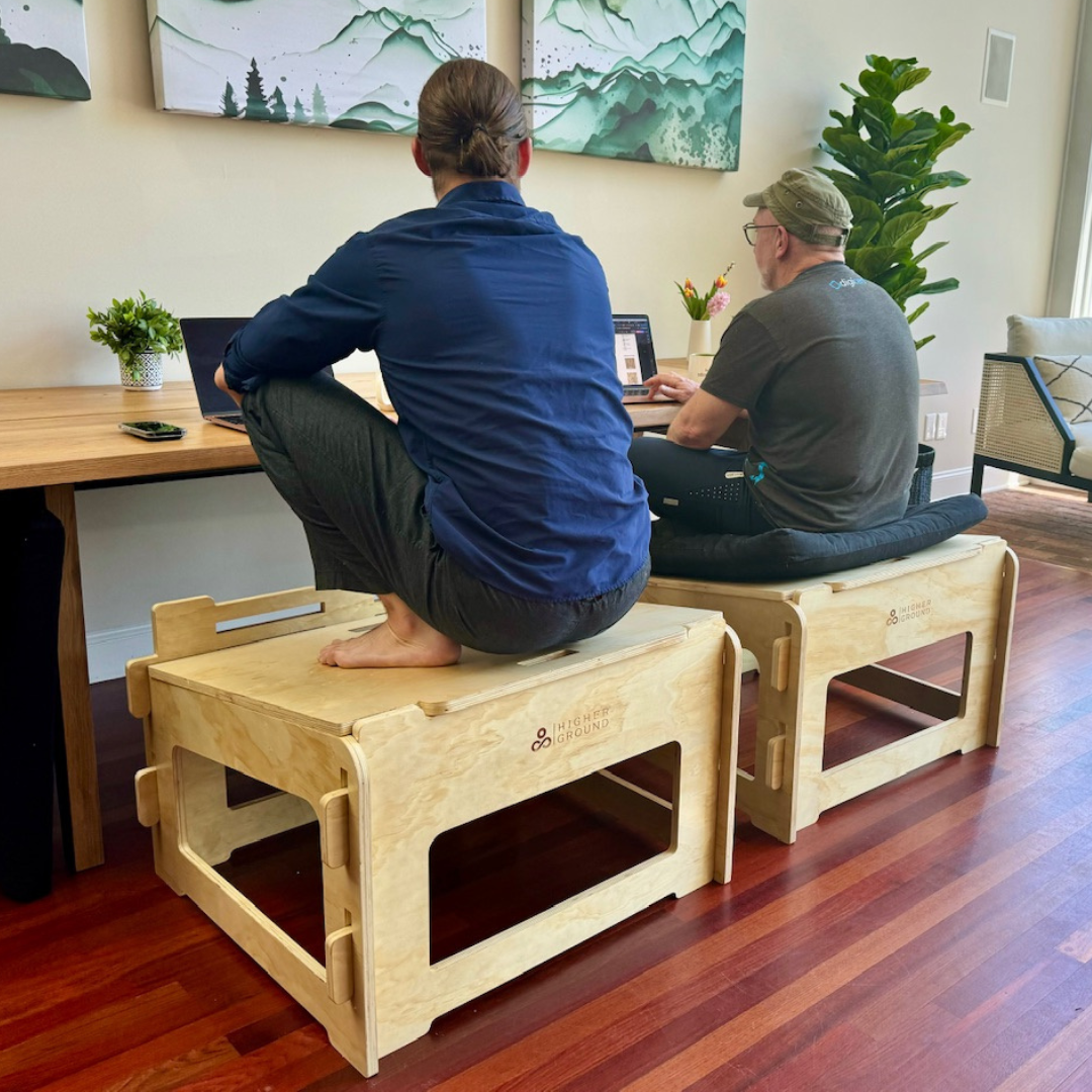 Two men sitting actively