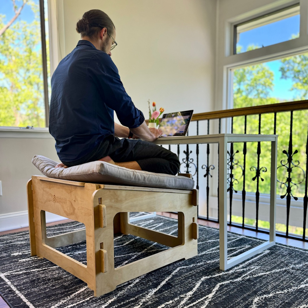 Man kneeling on higher ground chair