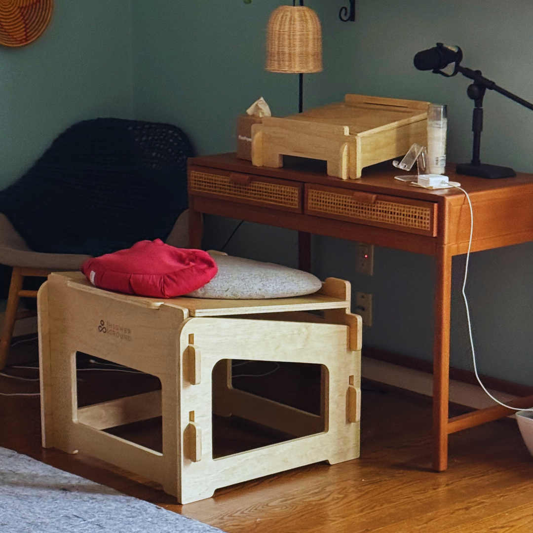 Small Higher Ground Chair at a desk with lamp, microphone, and laptop stand