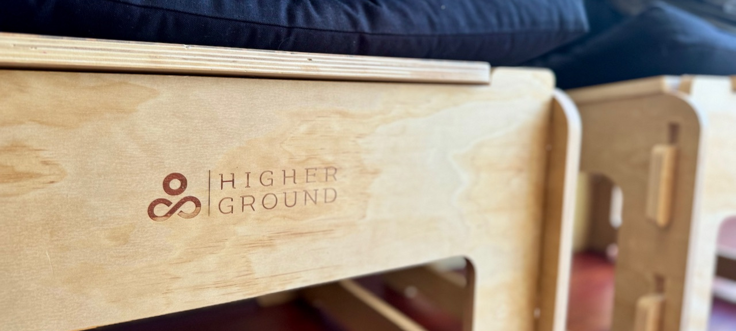 Back side closeup of a Higher Ground chair logo