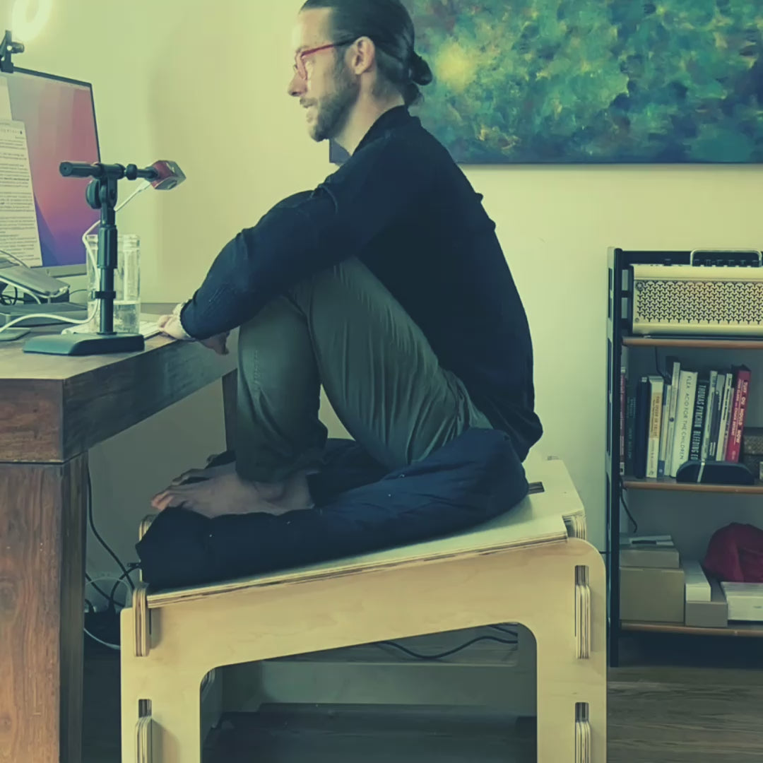 Time lapse video of a man sitting actively in front of a computer desk