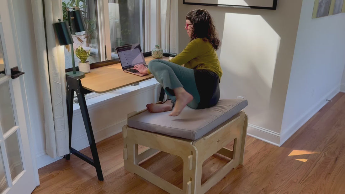 Video of woman moving through various sitting styles and postures